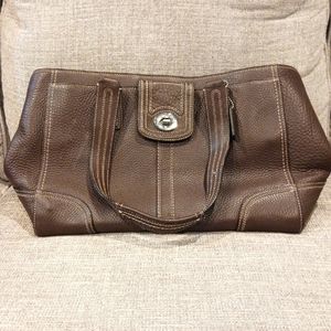 Brown leather coach bag. 16.5in long by 10.5 in wide.